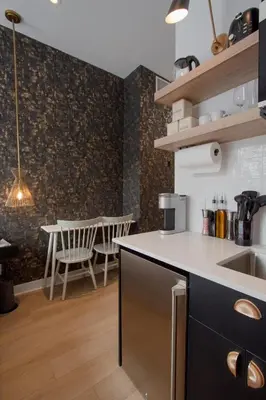 a kitchen with a counter and a dining room at Studio #2 - Self Check-In - Plateau - St-Denis in Montréal