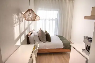 a bedroom with a bed and a window at Studio #3 - Self Check-In - Plateau - St-Denis in Montréal