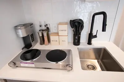 a kitchen counter with a sink and a coffee maker at Studio #4 - Self Check-In - Plateau - St-Denis in Montréal