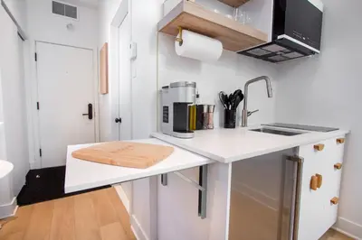 a small kitchen with a sink and a coffee maker on a counter at Studio #6 - Self Check-In - Plateau - St-Denis in Montréal