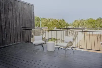 two chairs and a table on a deck at Studio #8 - Self Check-In - Plateau - St-Denis in Montréal