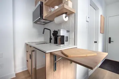 a kitchen with a counter with a coffee maker on it at Studio #9 - Self Check-In - Plateau - St-Denis in Montréal