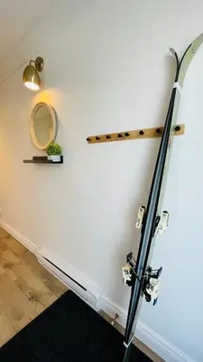 a room with a surfboard on the wall at Escape Mont Orford in Magog-Orford