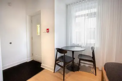 a small room with a table and two chairs at Studio #10 - Self Check-In - Plateau - St-Denis in Montréal