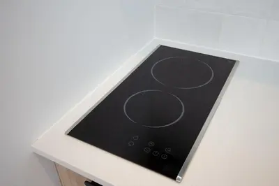 a stove top with circles on it on a counter at Studio #10 - Self Check-In - Plateau - St-Denis in Montréal