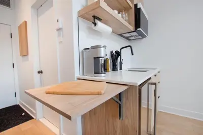a kitchen with a counter with a coffee maker on it at Studio #11 - Self Check-In - Plateau - St-Denis in Montréal