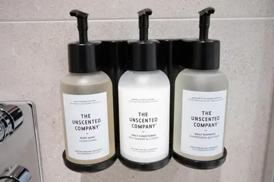 three bottles of the unexpected company products on a counter at Studio #12 - Self Check-In - Plateau - St-Denis in Montréal