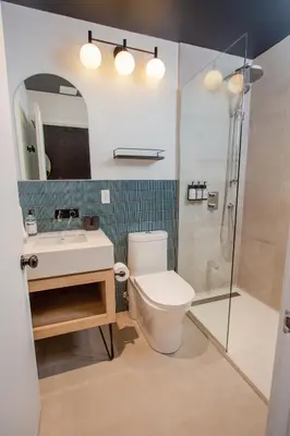 a bathroom with a toilet and a sink and a shower at Studio #15 - Self Check-In - Plateau - St-Denis in Montréal