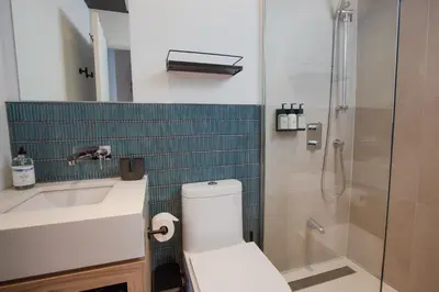 a bathroom with a toilet and a sink and a shower at Studio #15 - Self Check-In - Plateau - St-Denis in Montréal