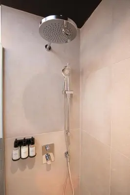 a shower with a shower head in a bathroom at Studio #15 - Self Check-In - Plateau - St-Denis in Montréal