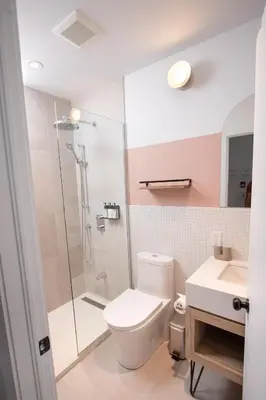 a bathroom with a toilet and a glass shower at Studio #16 - Self Check-In - Plateau - St-Denis in Montréal