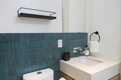 a bathroom with a sink and a toilet at Studio #17 - Self Check-In - Plateau - St-Denis in Montréal