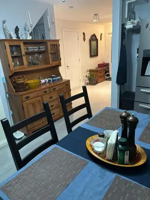 a dining room table with a plate of food on it at La Maison 4 Saisons, chambre-Hiver in Saint-Jean-sur-Richelieu