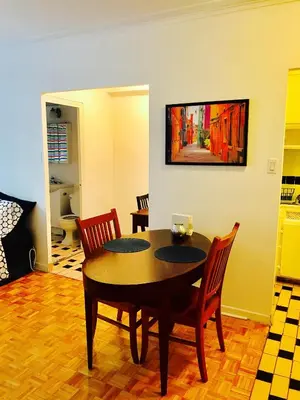 a dining room with a table and chairs at Stylish Montreal Apartment Comfortable Stay in the Golden Square Mile in Montréal