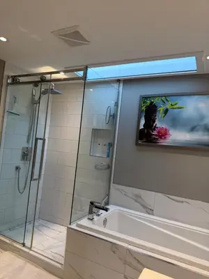 a bathroom with a shower and a tub and a sink at Cozy & spacious 3 BDR condo in Montréal
