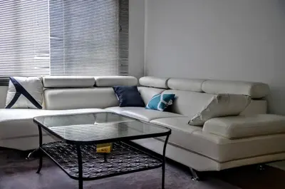 a white couch with a coffee table in a living room at Appartement chic in Montréal