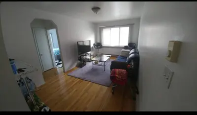 a living room with a couch and a table at Appartement chic in Montréal