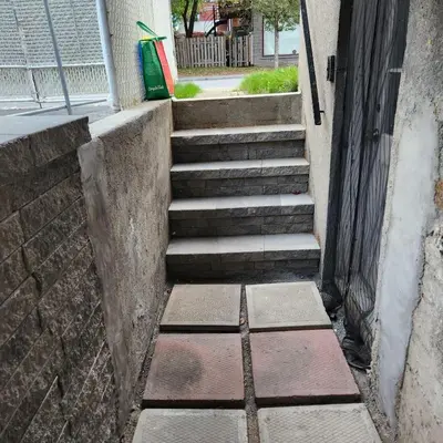 a set of stairs leading up to a building at Cute 2 BDR condo in Montréal