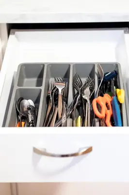 a drawer filled with scissors and other utensils at Great 3B unit on Saint-Urbain in Montréal