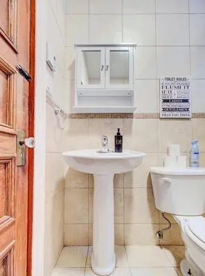 a bathroom with a sink and a toilet at Great 3B unit on Saint-Urbain in Montréal