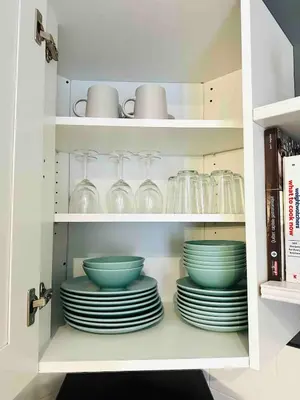 a cabinet filled with plates and bowls and glasses at Hochelaga 1 in Montréal
