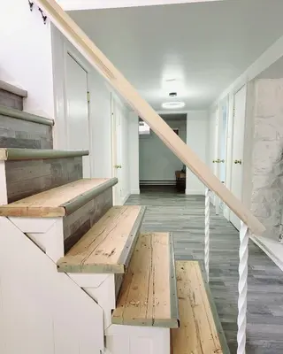 a stairwell with wooden benches in a building at 10 minutes to Montreal entire place 2 bedrooms private entrance in Laprairie