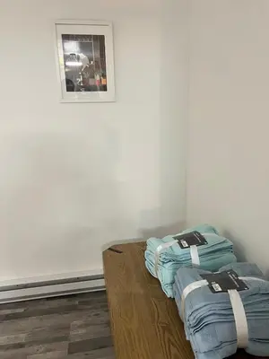 a room with two blue bags sitting on a table at 10 minutes to Montreal entire place 2 bedrooms private entrance in Laprairie