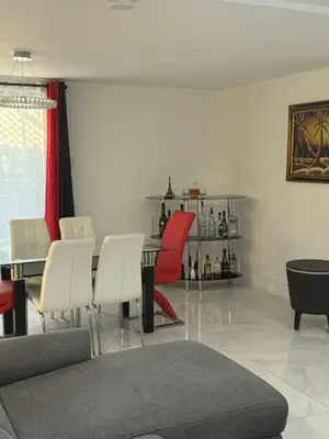 a living room with a table and chairs at Rima in Montréal