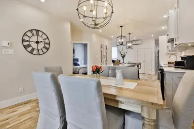a dining room and living room with a table and chairs at Les Lofts du Mile End-Plateau Mont Royal in Montréal