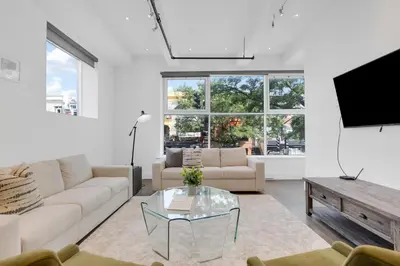 a living room with a couch and a table at Mont Royal Prime Residence in Montréal
