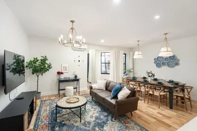 a living room with a couch and a table at Les Residences Saint Laurent- Parc Mont Royal in Montréal