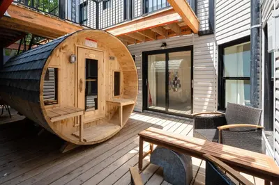 a large wooden sauna on the deck of a building at Les Residences Saint Laurent- Parc Mont Royal in Montréal