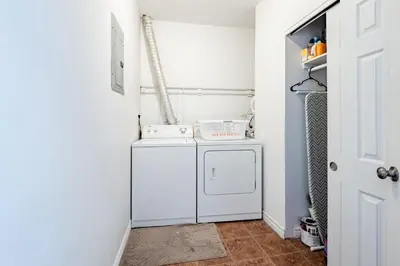 a laundry room with a washer and dryer at Apartment ROOMY - Plateau Mont-Royal in Montréal