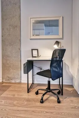 a black chair sitting in front of a desk at Welcome Chez Milou in Montréal