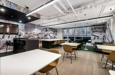 a conference room with tables and chairs and a tv at Welcome Chez Milou in Montréal