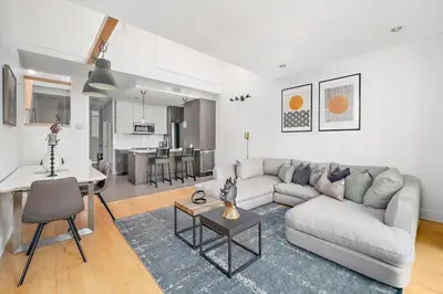 a living room with a couch and a table at 3 bedroom Penthouse Great for family vacation in Montréal