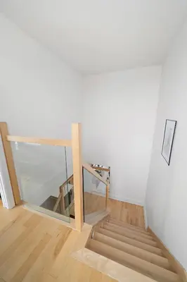 a staircase in a room with a glass railing at 3 bedroom Penthouse Great for family vacation in Montréal