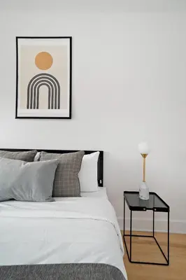 a bedroom with a bed and a side table at 3 bedroom Penthouse Great for family vacation in Montréal