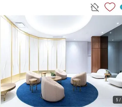a living room with couches and chairs and a blue rug at High-End Condo for Rent in Montréal