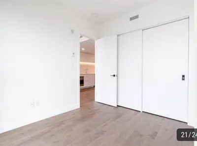 an empty room with white walls and white doors at High-End Condo for Rent in Montréal