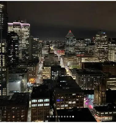 a view of a city at night with at High-End Condo for Rent in Montréal