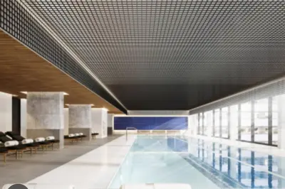 a large swimming pool in a building with a ceiling at High-End Condo for Rent in Montréal