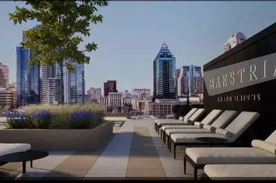 a row of benches sitting on top of a city skyline at High-End Condo for Rent in Montréal