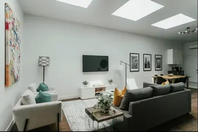 a living room with a couch and a table at Stylish and bright 2bdr near St-Hubert Plaza in Montréal