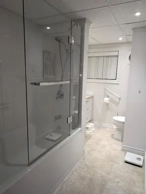 a bathroom with a shower and a toilet at Style Chalet in Montréal
