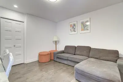 a living room with a couch and a table at Le Bijou Airhome in Montréal