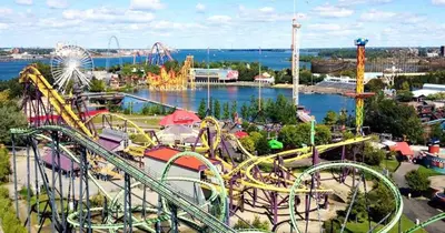 an amusement park with a roller coaster and rides at Tranquille Discret Privé in Laval