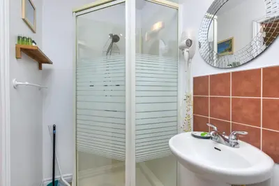 a bathroom with a shower and a sink at Fox Aparthotel Palais Des Congres III in Montréal