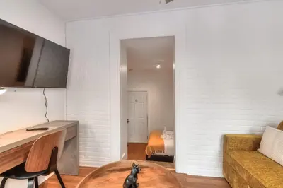 a living room with a couch and a table at Fox Aparthotel Palais Des Congres III in Montréal