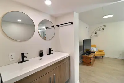 a bathroom with a sink and a mirror at Private Charming Twin Room & Parking in Saint-Bruno-de-Montarville